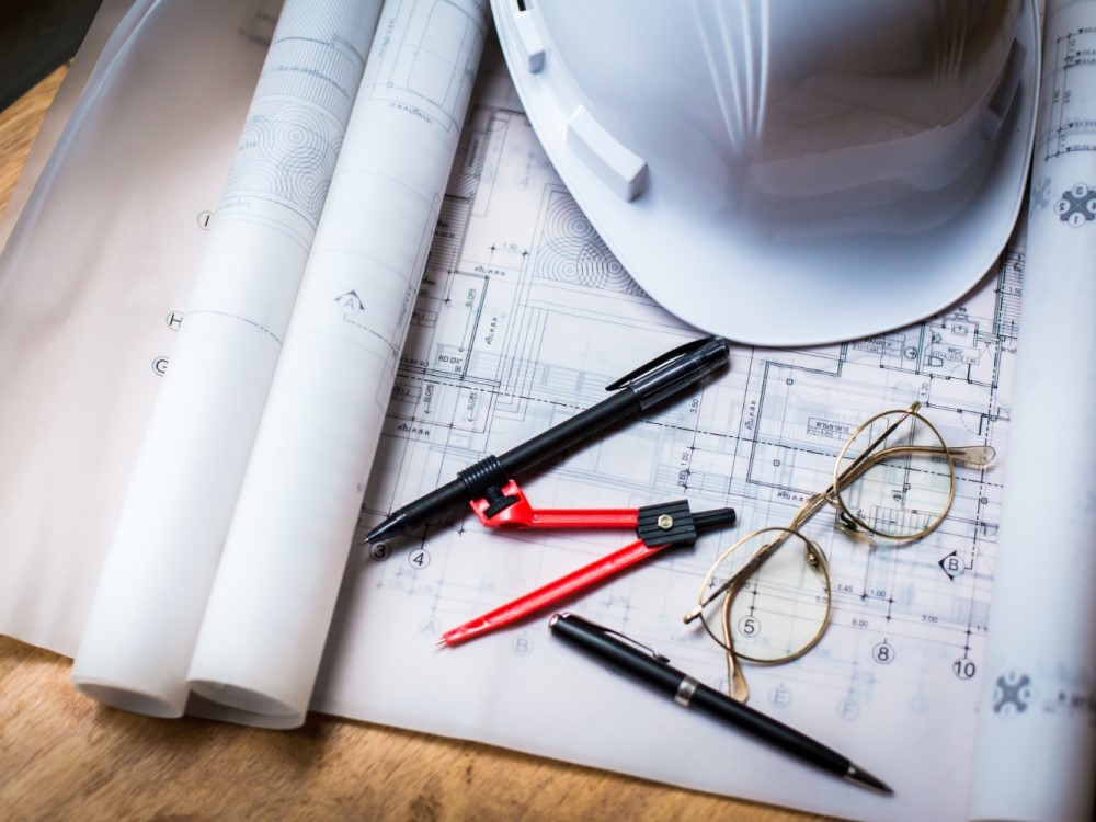 construction-concept-image-helmet-rolled-blueprints-wooden-boards-retro-style